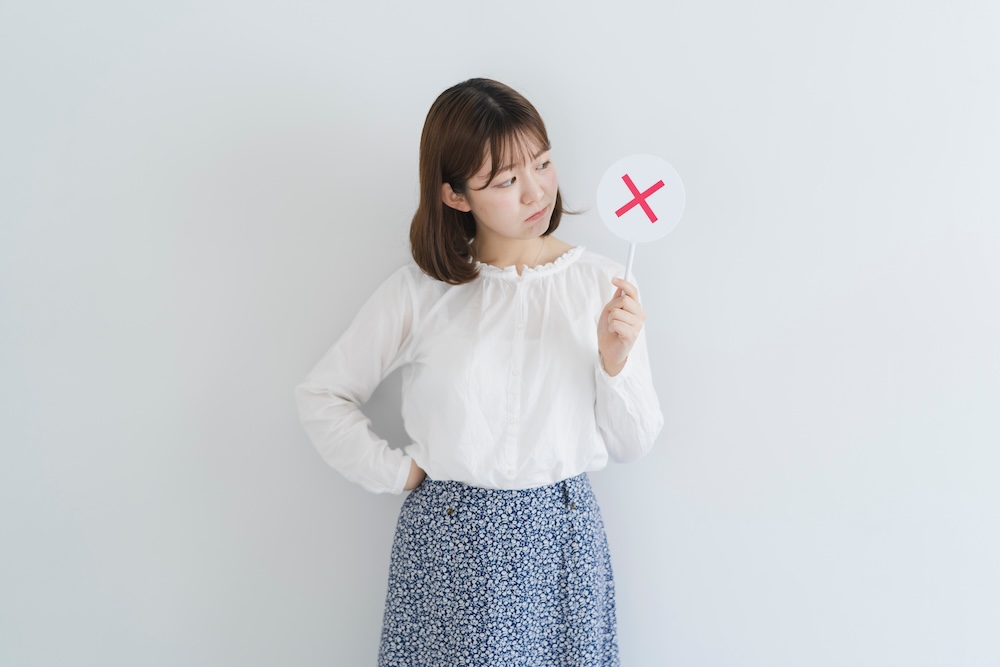 バツを持っている女性